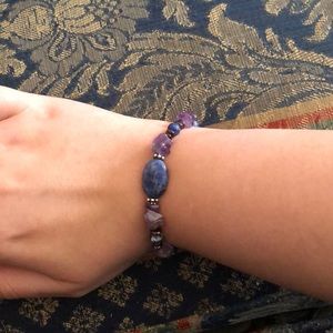 Bracelet with purple crystals and blue beading.